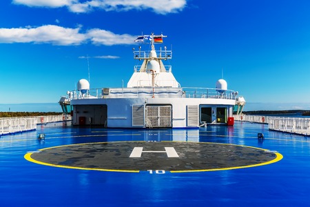 Helipad for helicopter on the upper deck of big cruise ship