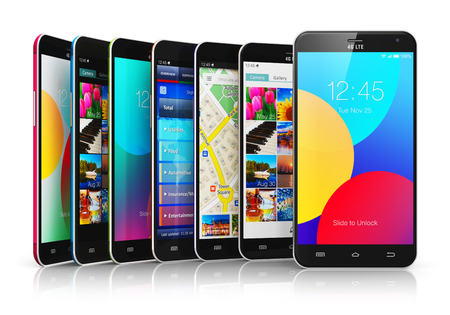 Creative abstract mobile phone wireless communication technology and mobility business office concept: group of modern metal black glossy touchscreen smartphones with colorful application interfaces with color icons and buttons isolated on white backgrounの写真素材
