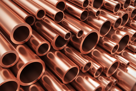 Creative abstract heavy non-ferrous metallurgical industry and industrial manufacturing business production concept: heap of shiny metal copper pipes with selective focus effect