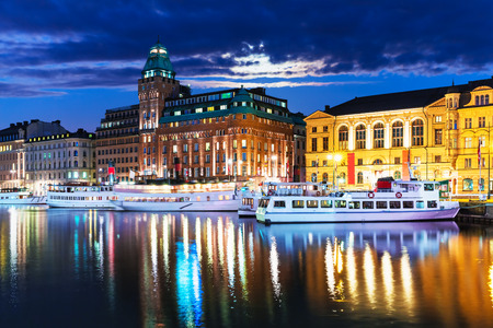 Scenic summer night panorama of the Old Town Gamla Stan architecture pier in Stockholm, Swedenの写真素材