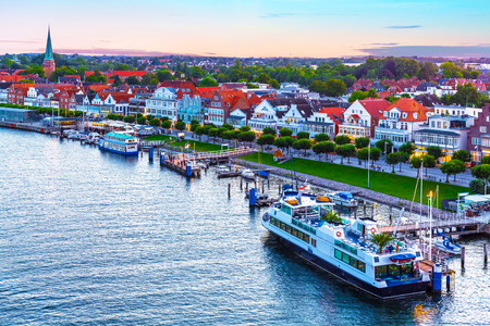 Scenic evening panorama of the Old Town pier architecture in Travemunde, Germanyの写真素材