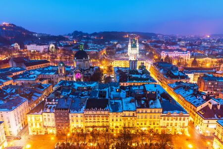 Scenic winter night snowy aerial view of the Old Town architecture in Lviv, Ukraineの写真素材