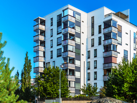 Creative abstract house building and city construction industry concept: summer outdoor urban view of modern real estate homesの写真素材