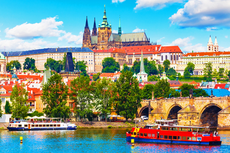 Scenic summer panorama of the Old Town architecture with Vltava river, Charles Bridge and St.Vitus Cathedral in Prague, Czech Republicの写真素材