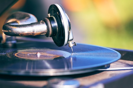 Macro view of the old style retro vintage music record player turntable with vinyl discの写真素材