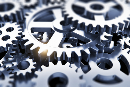 Creative abstract 3D render illustration of the macro view of the set of metal shiny gears or cogwheels with selective focus effectの写真素材
