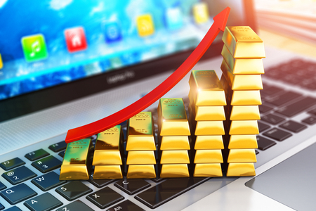 Creative abstract stock exchange market trading, online banking, making money and internet business success technology communication concept: 3D render illustration of the macro view of bar graph from gold ingots or bullions with red arrow on laptop or notebook computer PC with selective focus effectの写真素材