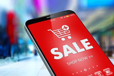 Creative abstract business marketing and online shopping discount concept: color 3D render illustration of sale word advertisement banner with shopping cart icon on the screen of modern black glossy touchscreen smartphone or mobile phone in the fashion wear shopping mall with selective focus blur bokeh effectの写真素材