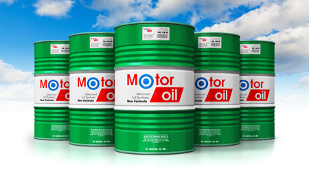 Creative abstract automotive industry and auto repair service and maintenance concept: 3D render illustration of the group of green metal drum canisters or barrel containers with car motor engine liquid synthetic oil lubricant against blue sky with clouds isolated on white background with reflection effectの写真素材