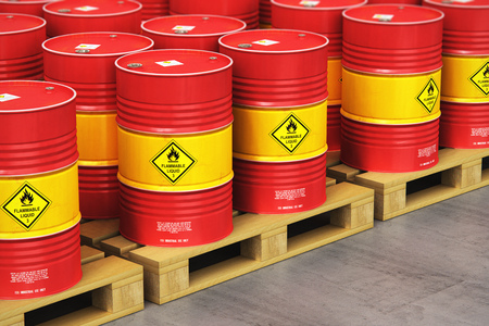 Creative abstract oil and gas industry manufacturing and trading business concept: 3D render illustration of the group of red metal oil drums or petroleum barrels on wooden shipping pallets in the industrial storage warehouse with selective focus effectの写真素材