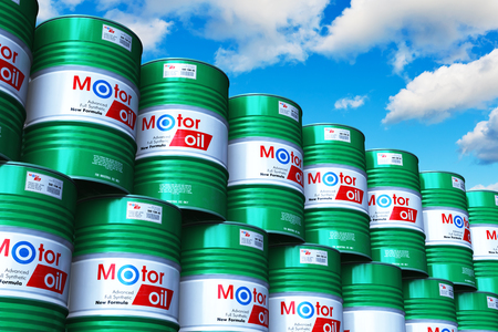Creative abstract automotive industry and auto repair service and maintenance concept: 3D render illustration of the group of green stacked metal drum canisters or barrel containers with car motor engine liquid synthetic oil lubricant in the industrial storage warehouse against blue sky with cloudsの写真素材