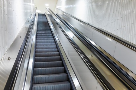Moving staircase or escalator to the metro subway underground stationの写真素材
