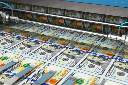 Business success, finance, banking, accounting and making money concept: printing 100 US dollar USD money paper cash banknotes on print machine in typographyの写真素材