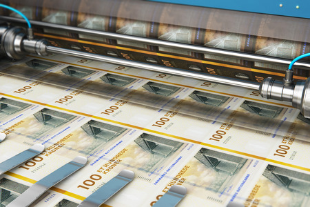 Business success, finance, banking, accounting and making money concept: printing 100 DK Danish krona money paper cash banknotes on print machine in typographyの写真素材