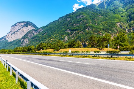 Scenic summer view of the empty autobahn in Alps Mountains, Switzerlandの写真素材