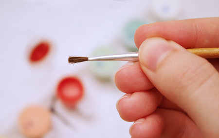 paint by number with paints and brushの写真素材