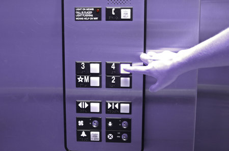  Hand pressing elevator button
