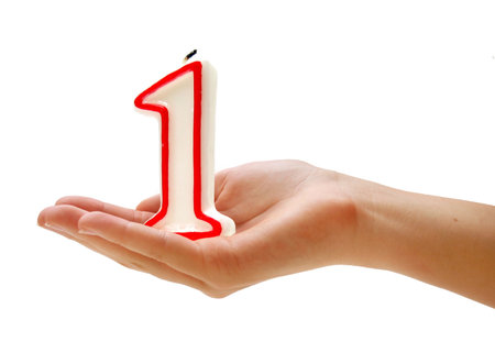  one-year candle in handの写真素材