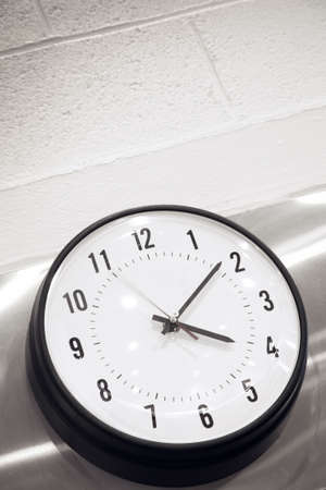 Stylish clock in a libraryの写真素材