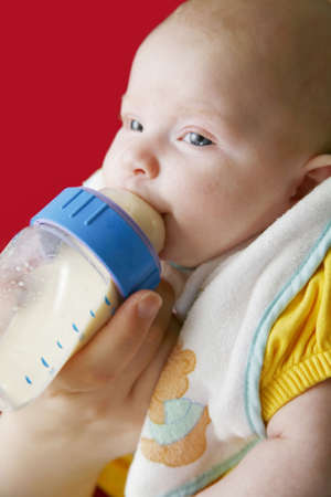 Baby girl feedingの写真素材