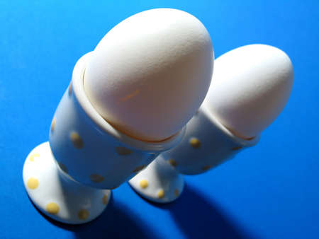 Two egges in yellow polka dot egg holdersの写真素材