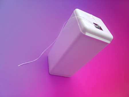 An unlabelled container of dental floss.の写真素材