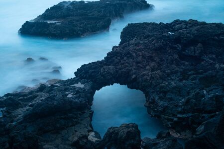 Mystery cave in the coastの写真素材
