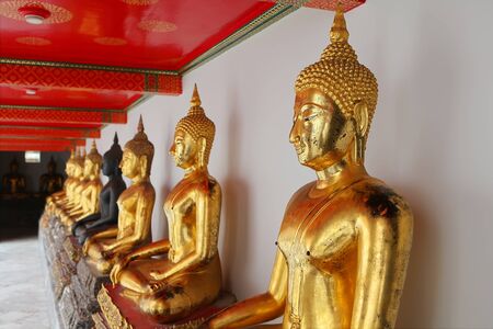 Black Buddha between Golden Buddhas, Wat Pho, Thailand の写真素材