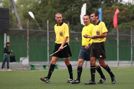 BELGOROD, RUSSIA - AUGUST 20  Unidentified football arbitrators walk on field on August, 20 2010 in Belgorod, Russia  The is the final of Chernozemje superiority, football team for kids born in 1996  のeditorial素材