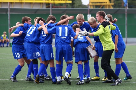 BELGOROD, RUSSIA - AUGUST 20  Unidentified boys embrace before football game on August, 20 2010 in Belgorod, Russia  The final of Chernozemje superiority, Football kinder team of 1996 year of birth  のeditorial素材
