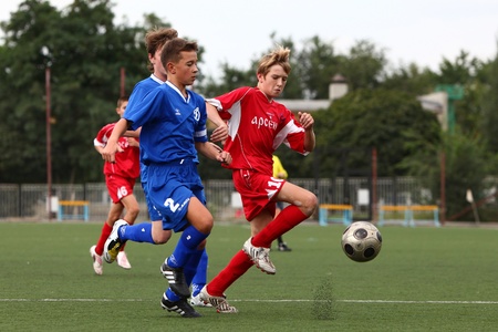 BELGOROD, RUSSIA - AUGUST 20  Unidentified boys plays football on August, 20 2010 in Belgorod, Russia  The final of Chernozemje superiority, Football kinder team of 1996 year of birth  のeditorial素材