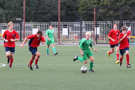 BELGOROD, RUSSIA - AUGUST 21  Unidentified boys plays football on August, 21 2010 in Belgorod, Russia  The final of Chernozemje superiority, Football kinder team of 1996 year of birth  のeditorial素材