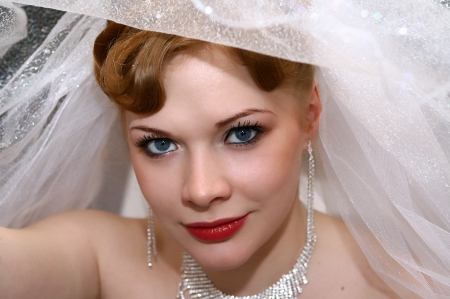 Young beautiful bride with red hairの写真素材