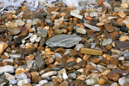 Wet stones on the sun in summerの写真素材