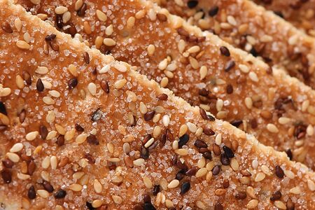 Sesame cakes with cocoa and sugar background
