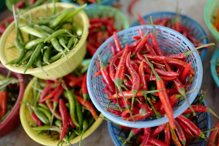 Red and green chile pepper on thai marketの写真素材