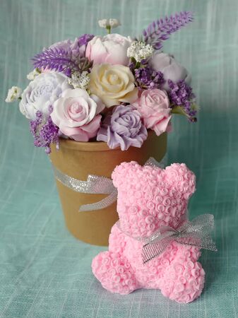 Decor for the house from soap - a bouquet of flowers peons, roses and lavender and pink bear from rosesの写真素材