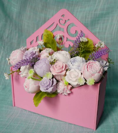 Bouquet of soap flowers in pink envelopeの写真素材
