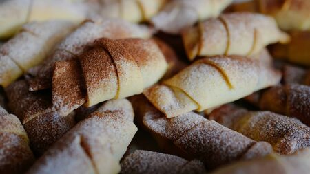 Delicious pastries with cinnamon sprinkling and sugar powderの写真素材