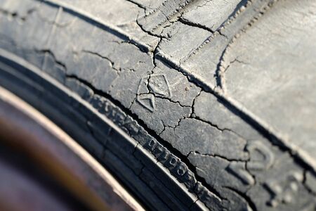Old wheel with spoiled rubber