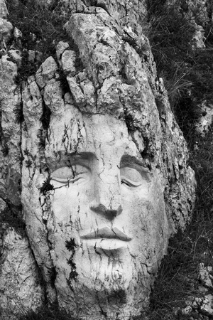A face carved directly into the side of a mountainのeditorial素材