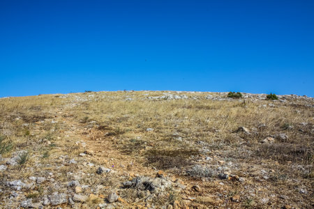 Rocky climb up the mountain and blue sky.の写真素材
