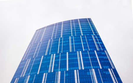 UKRAINE. KYIV - 03/21/2021 Part of facade of a tall glass building on a white background. Modern abstract architectureのeditorial素材