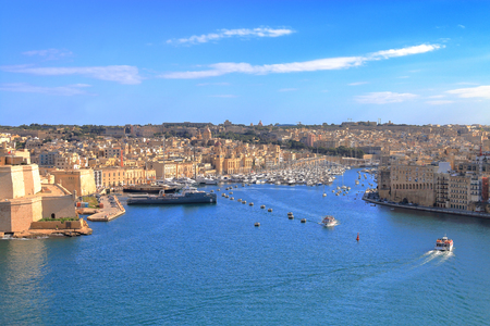 The photo was taken in the month of January in Malta. The picture shows a view of the islandâs harbor from the height of the city of Valletta. Far off you can see the marina with moored yachts.の写真素材