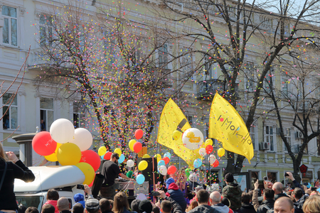 ODESSA, UKRAINE - APRIL 01, 2017. The photo shows a traditional celebration of humor and laughte.The picture shows a mobile platform with DJ playing on it. And a candy generator that shoots from this mobile platform.のeditorial素材