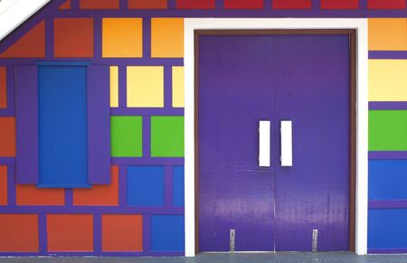 Colorful wooden door of the wood-paneled walls.の写真素材