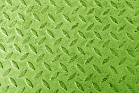 Background of metal diamond plate in green color.の写真素材