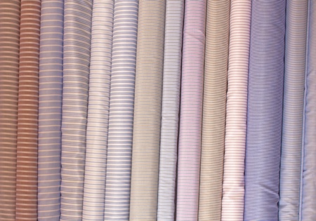 Rainbow clothes background  Pile of bright folded clothes 