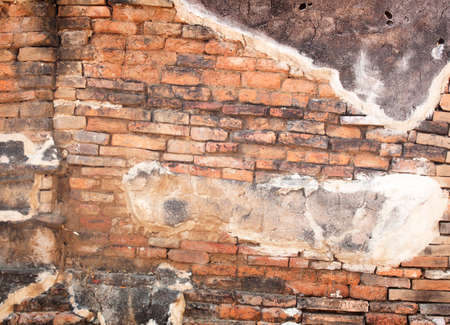 Abstract red brick wall of old decaying erosion.の写真素材