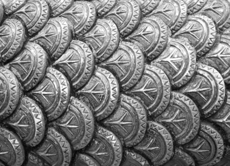 Scales of the dragon statue. Stucco surface of the animalの写真素材